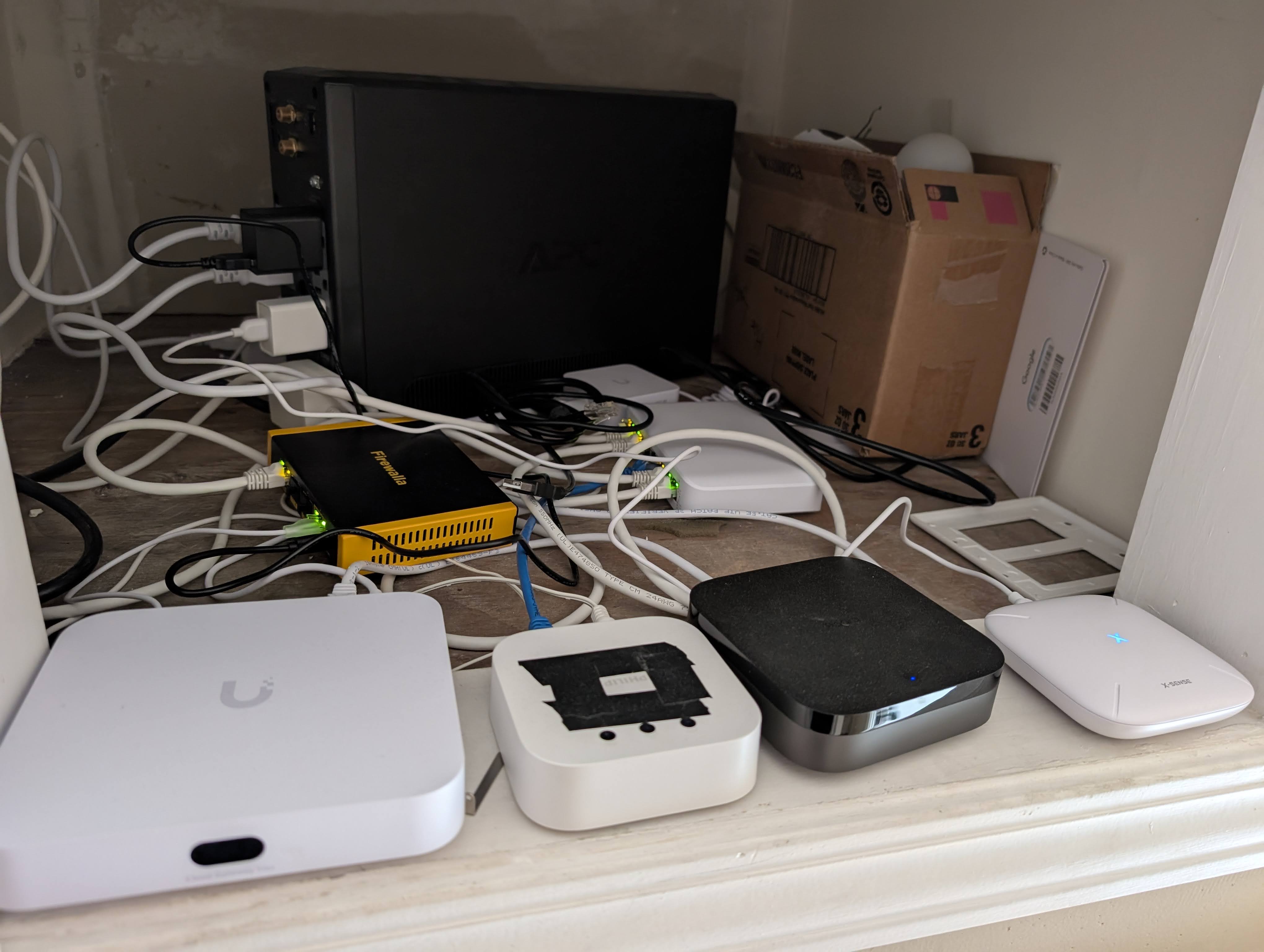 Image of hallway cubby showing devices tucked away